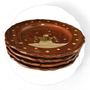 Four stoneware Christmas Plates